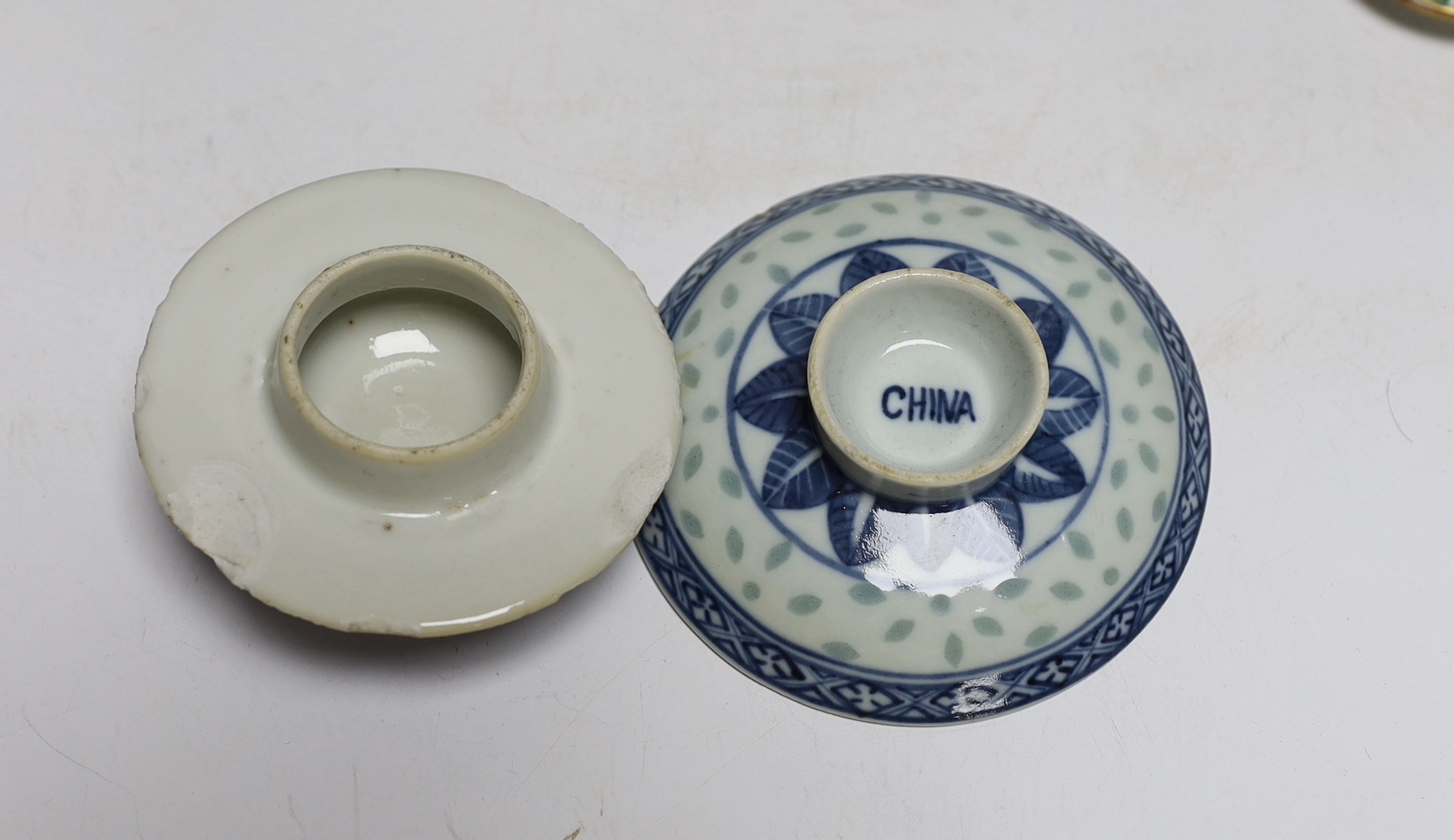 A collection of Chinese and Japanese ceramics including two famille rose teapots, a vase, four saucers, etc. (8)